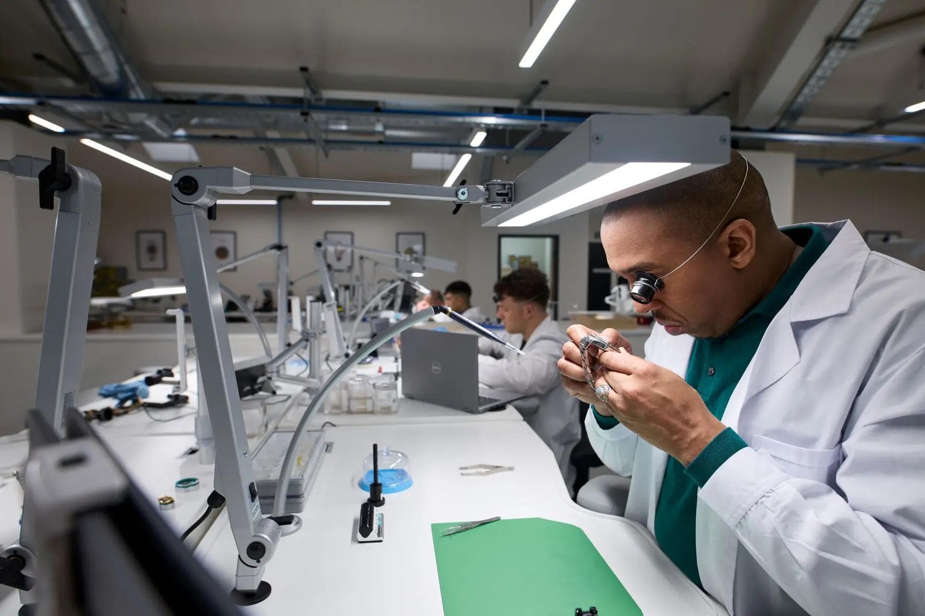 A man is examining the watch