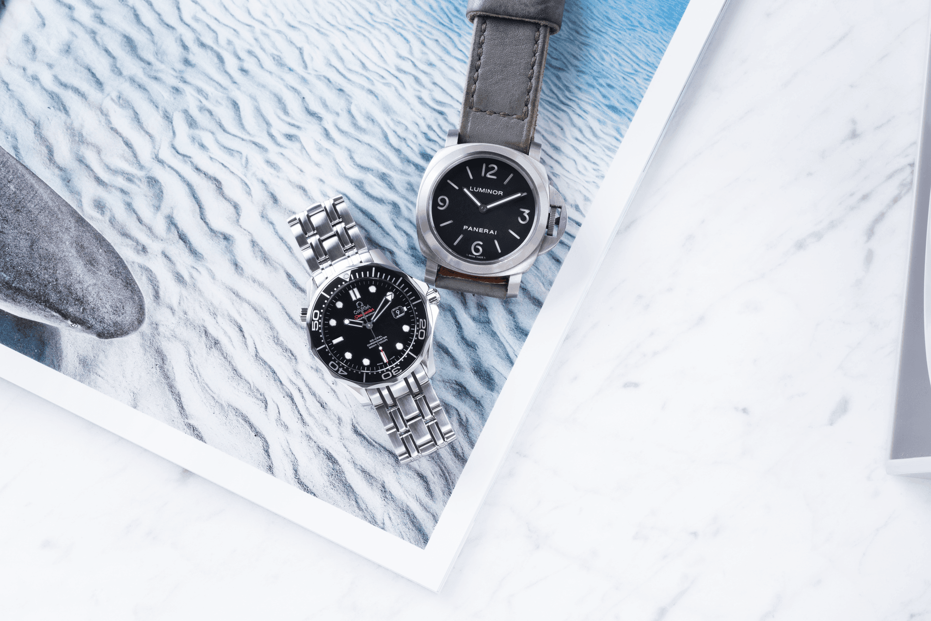 two different model watches on the table