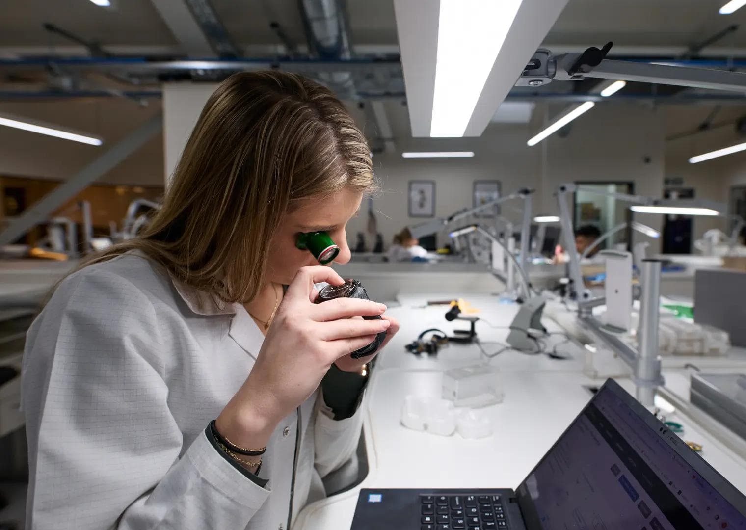 she is examining the watch deeply