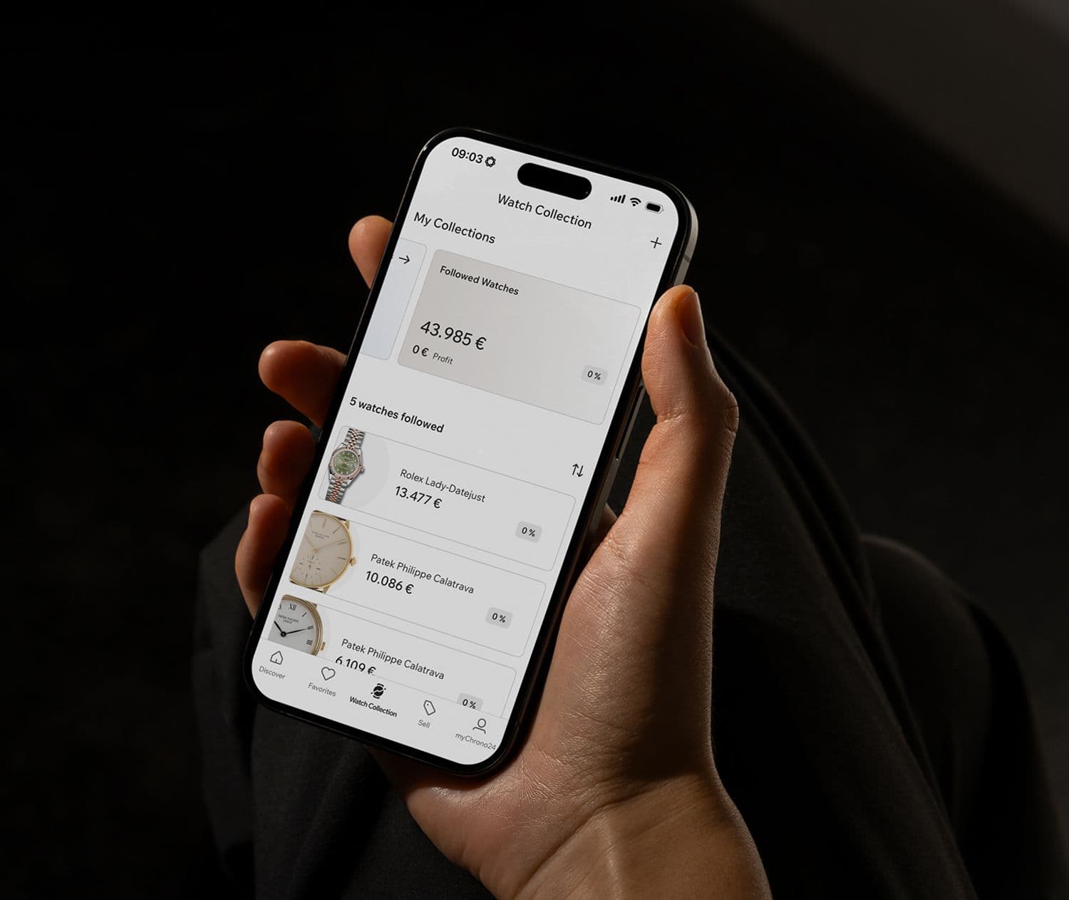 hand holding a smartphone with the watch collection open